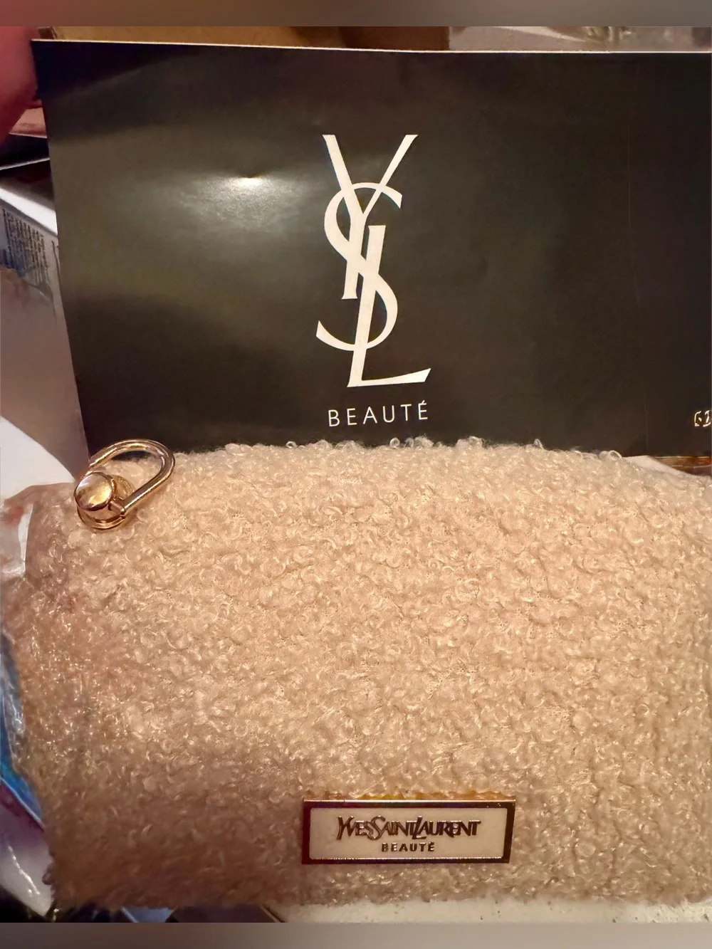 Yves Saint Laurent beaute Cream shearling pouch with gold hardware